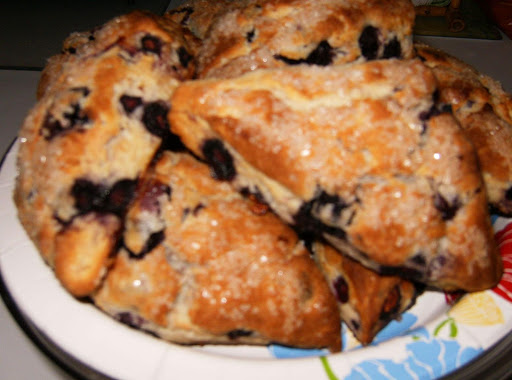 Blueberry Scones, fresh from the oven, sprinkled with sanding sugar before baking. The sugar gives a nice crunch when you bite into the tender biscuit of a scone.