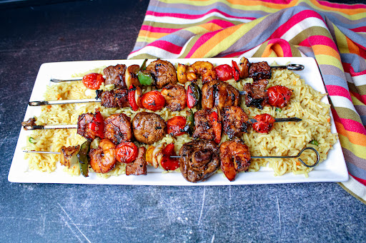 A platter of Teriyaki Beef and Shrimp Kabobs.