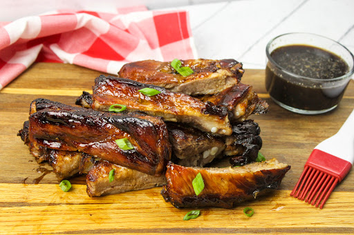 David's BBQ Pork Ribs on a cutting board.