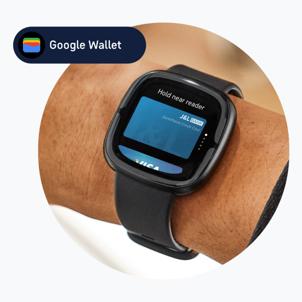 Watch on wrist showing the credit card screen.