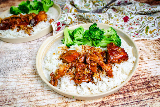 A plate of Crock Pot Honey Chicken and Rice.
