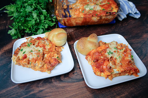 Slices of Lasagna With Vodka Sauce on two plates.